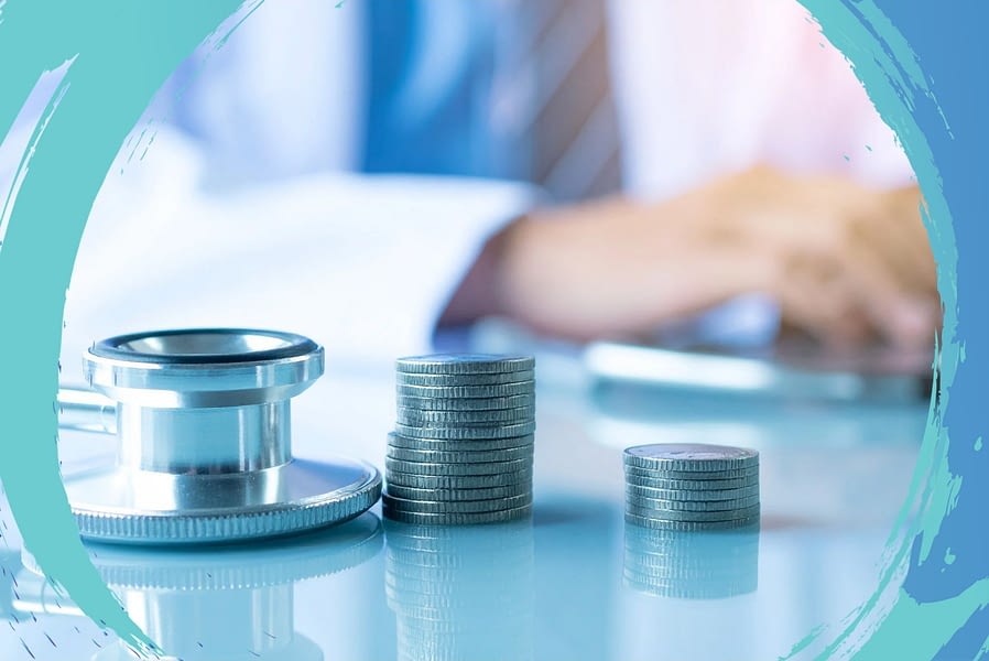 Stacks of coins next to a stethoscope.